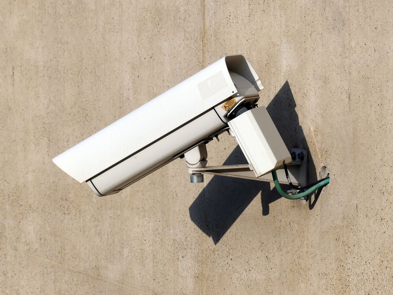Security camera mounted on an exterior wall